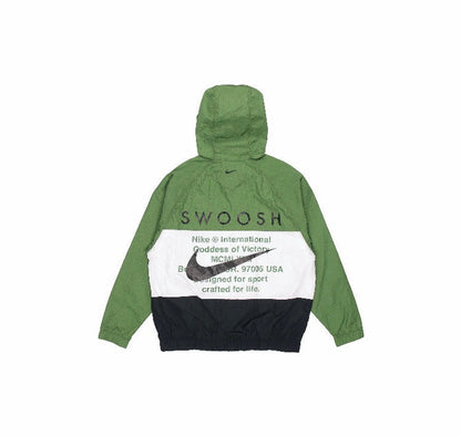 Green and black hooded Nike windbreaker with Swoosh logo and graphic text on back