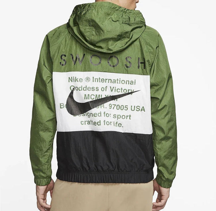Green hooded Nike windbreaker with Swoosh logo and vintage-style graphic text on back