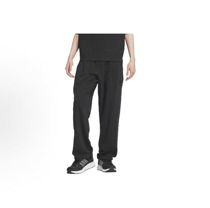 Black track pants with elastic waistband and tapered fit