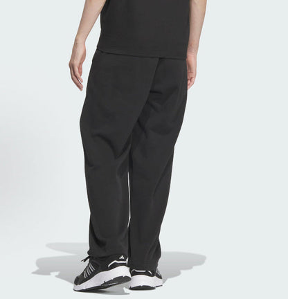 Black track pants with angled side seam and tapered leg opening