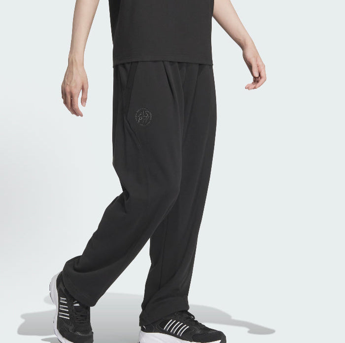 Black track pants with subtle adidas logo on left thigh