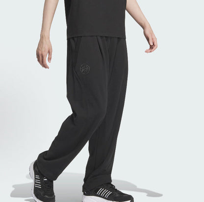Black track pants with subtle adidas logo on left thigh