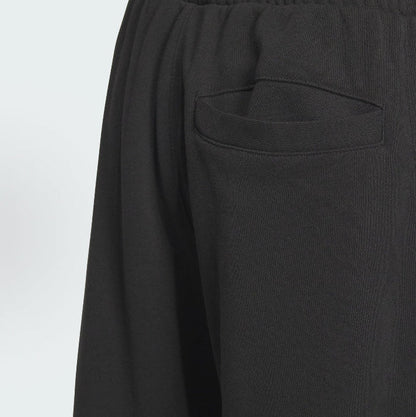 Black track pants with welt pocket and elastic waistband