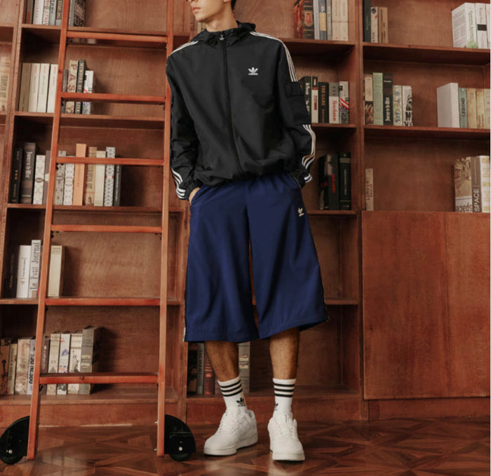 Adidas track jacket, black with hood, white sleeve stripes, and zip front