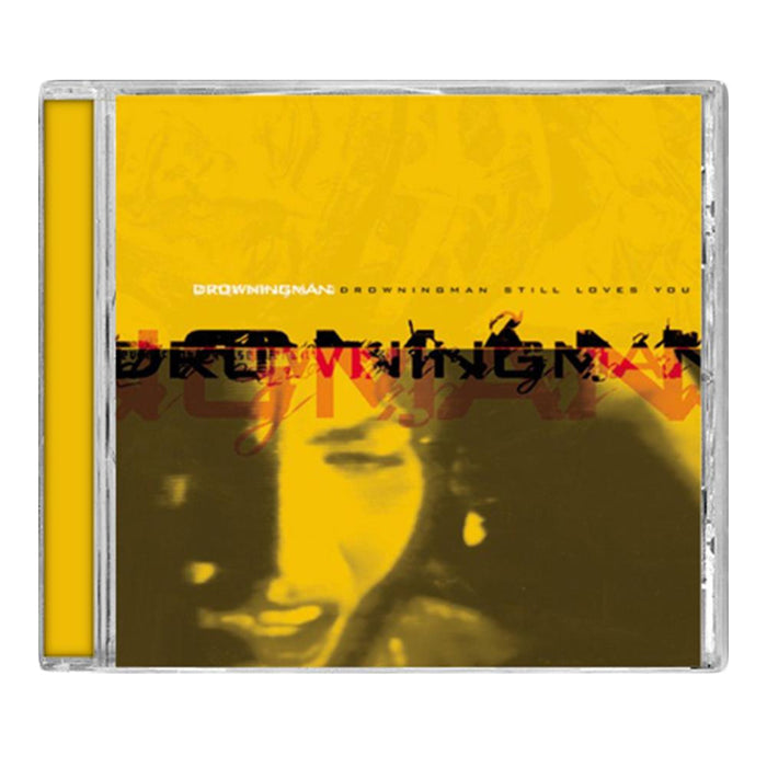 A CD case from Drowningman with a yellow cover, distorted "Still Loves You" text, and a blurred emotional face in the background, hinting at intense melodic metal and hardcore tracks inside.