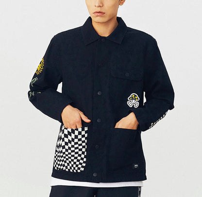 Vans black jacket on model with checkered chest pocket and flower sleeve patches