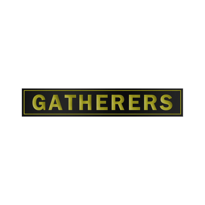 A black rectangular Gatherers sign features bold yellow capital letters, outlined with a thin yellow border, reminiscent of an enamel design, all set against a white background.
