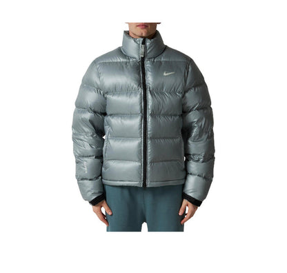 Puffer jacket on model with full-zip, stand collar, Nike logo, gray metallic finish