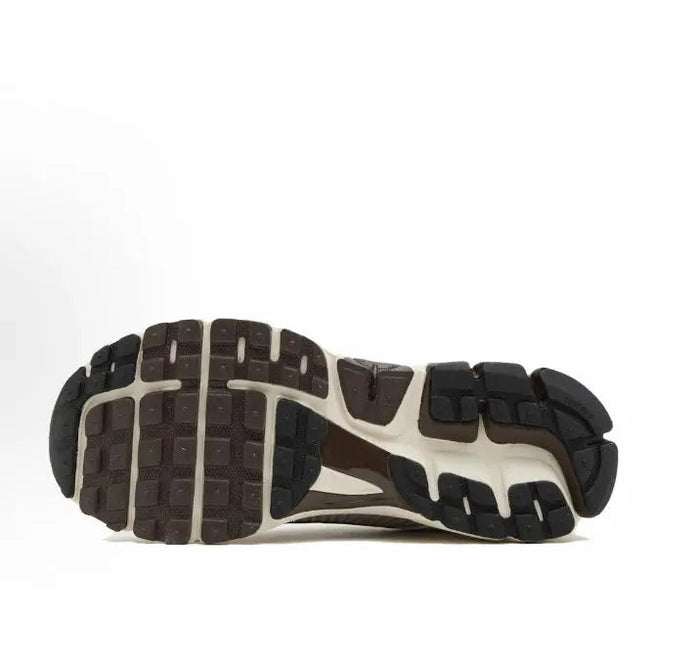 Nike running shoes: visible tread outsole with dark traction blocks