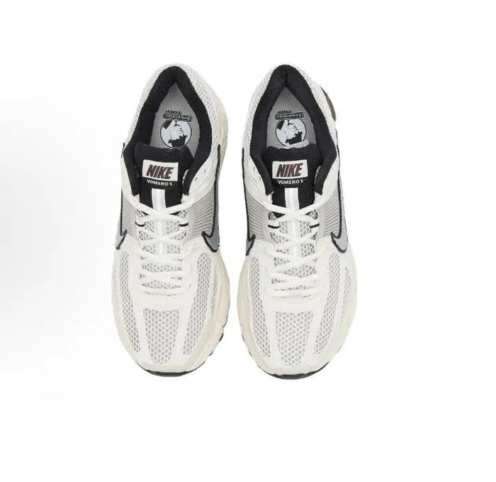 Nike running shoes: white tongue and collar with Nike logo patch