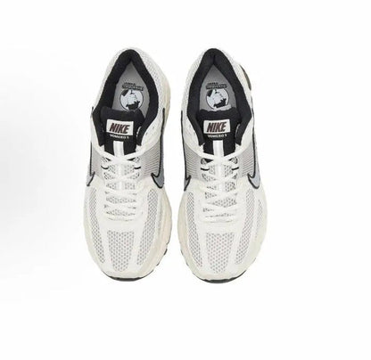 Nike running shoes: white tongue and collar with Nike logo patch